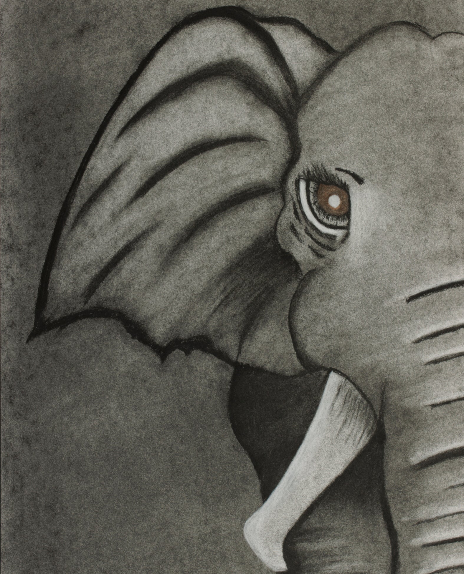 A jigsaw puzzle piece depicting a detailed monochrome elephant.