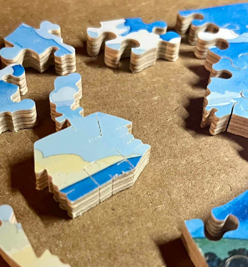 Puzzle pieces with a cabin on a wooden surface